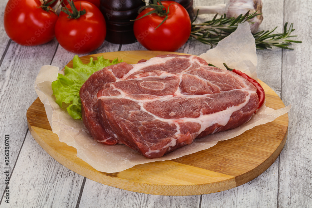 Raw pork neck steak