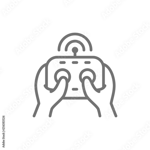 Hands holds remote controller, control panel for drone, gamepad line icon.