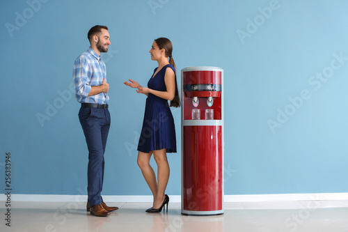 Man and woman near water co...