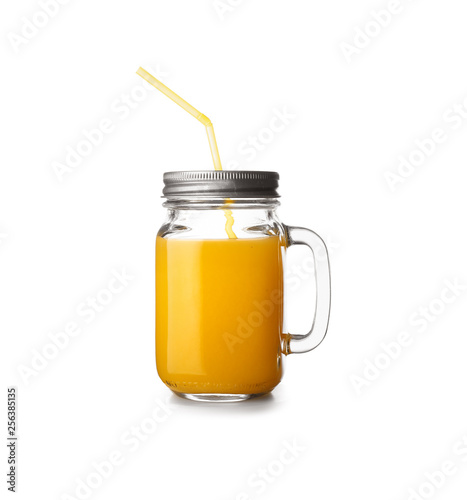Mason jar of tasty orange juice on white background