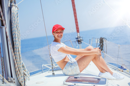 Beautiful Girl relaxing On Yacht in Greece © Max Topchii