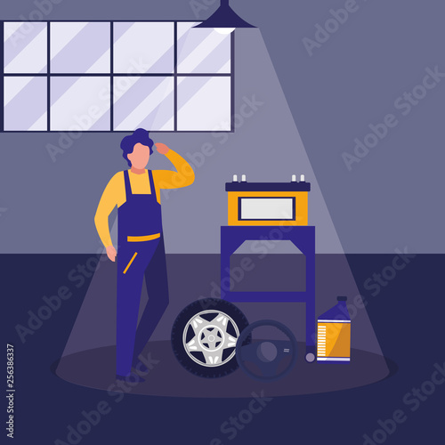 mechanic worker with tire car and battery