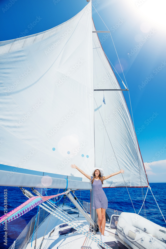 Obraz premium Beautiful Girl relaxing On Yacht in Greece