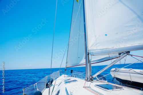 Sailing. Ship yachts with white sails in the open Sea.