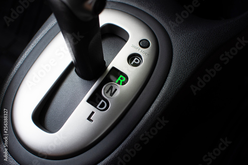 Put a gear stick into R position, (Reverse) Symbol in auto transmission car. photo