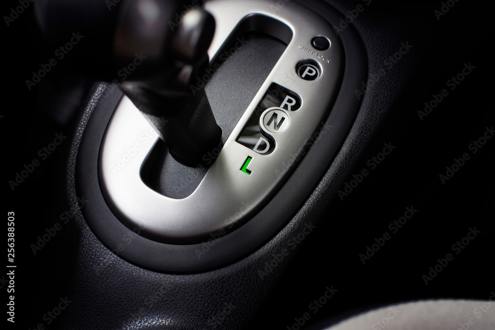 Put a gear stick into L position, (Low) Symbol in auto transmission car.  Stock Photo | Adobe Stock
