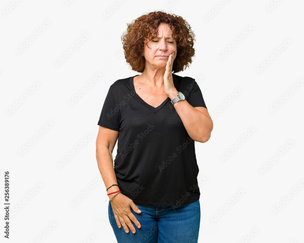Beautiful middle ager senior woman over isolated background touching mouth with hand with painful expression because of toothache or dental illness on teeth. Dentist concept. Beautiful middle ager senior woman over isolated background touching mouth with hand with painful expression because of toothache or dental illness on teeth. Dentist concept.