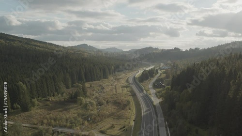 Wallpaper Mural Aerial drone view of trucks on motorway in mountains at sunset Torontodigital.ca