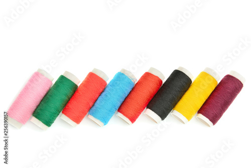 Color sewing threads on white background