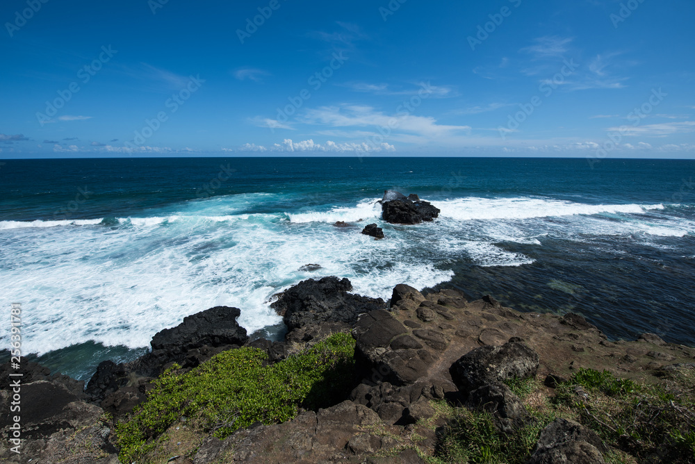 Ocean waves crashing on rocky beach