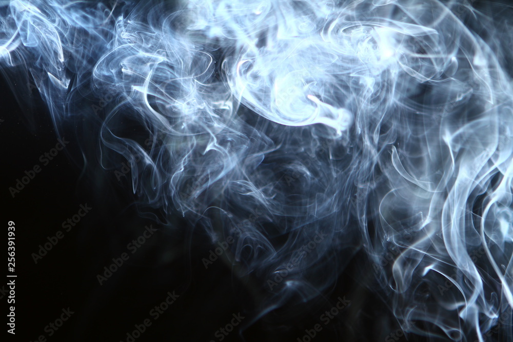 Fototapeta premium amazing abstract glowing bright smoke on the heavy black background.