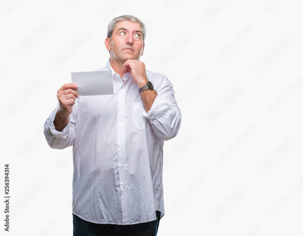 Handsome senior man holding blank card over isolated background serious face thinking about question, very confused idea Handsome senior man holding blank card over isolated background serious face thinking about question, very confused idea