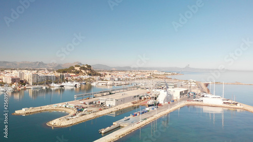 Aerial view of Denia port. The city and the Denia castle in the background. © MiniMoon Photo
