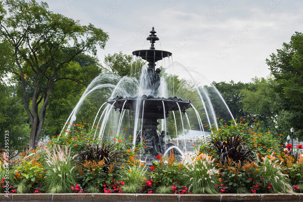 Fototapeta premium Mid-19th Century elegant circular French-style Fontaine de Tourny on the Parliament Hill, Quebec City, Quebec, Canada