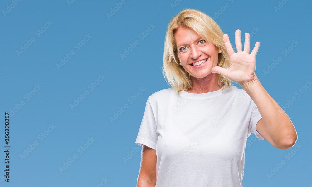 Fototapeta premium Middle age blonde woman over isolated background showing and pointing up with fingers number five while smiling confident and happy.