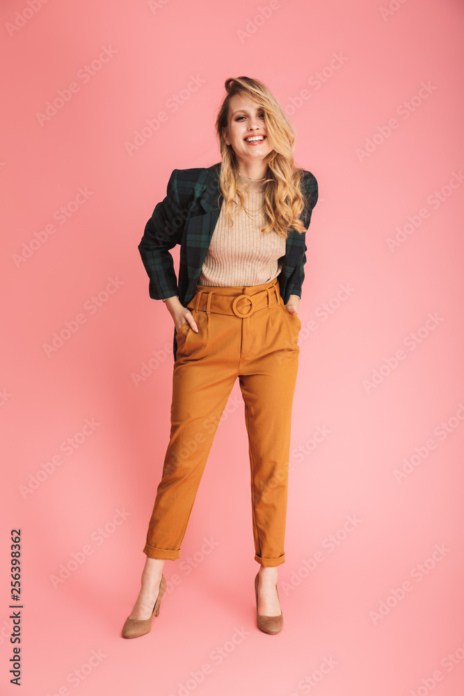 Portrait of adorable blond woman 30s in stylish outfit smiling and posing on camera Portrait of adorable blond woman 30s in stylish outfit smiling and posing on camera