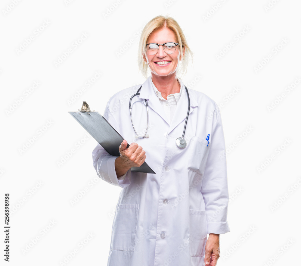Middle age blonde doctor woman holding clipboard over isolated background with a happy face standing and smiling with a confident smile showing teeth Middle age blonde doctor woman holding clipboard over isolated background with a happy face standing and smiling with a confident smile showing teeth