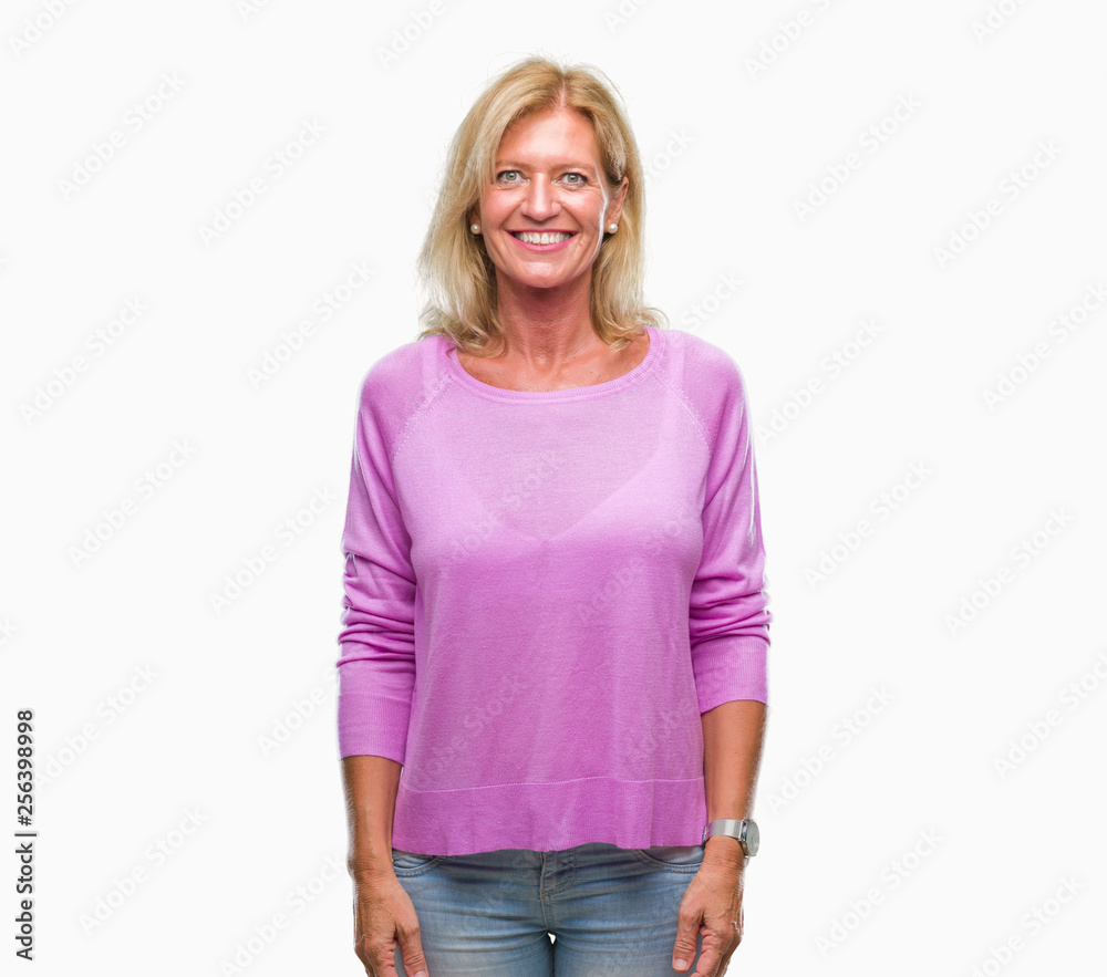 Middle age blonde woman over isolated background with a happy and cool smile on face. Lucky person. Middle age blonde woman over isolated background with a happy and cool smile on face. Lucky person.