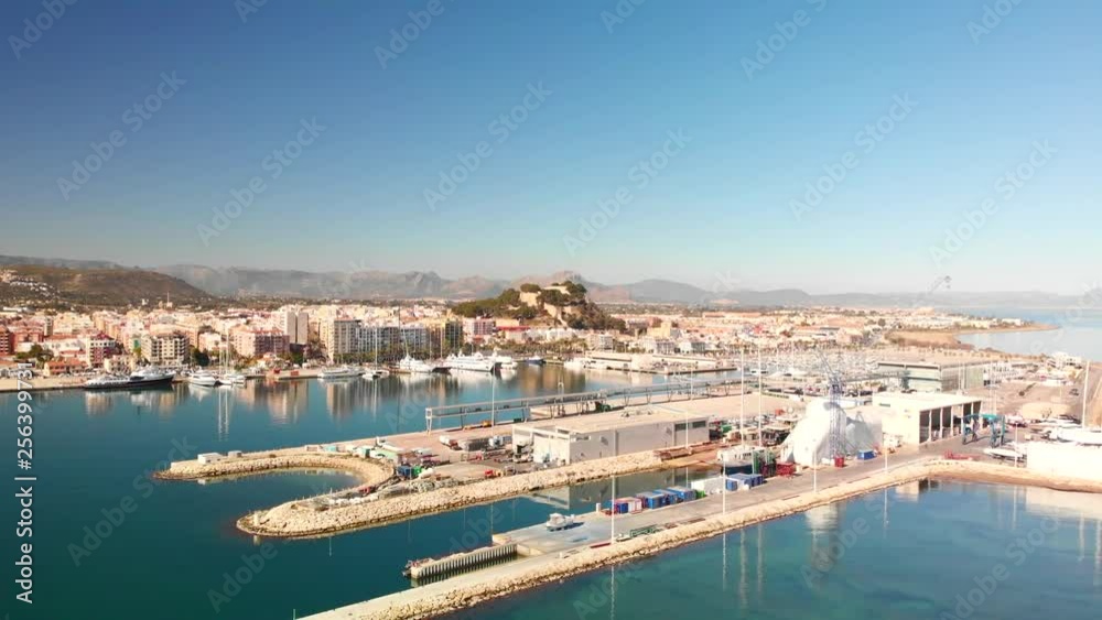Aerial view of Denia port. The city and Montgo mountain in the background. Aerial view of Denia port. The city and Montgo mountain in the background.