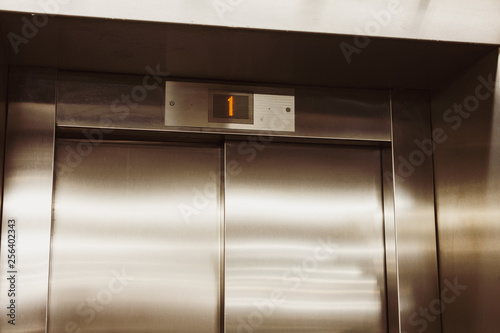 Closed door of the lift. Elevator on the first floor.