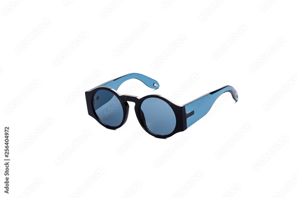 Fototapeta premium Sunglasses with blue glasses on an isolated white background