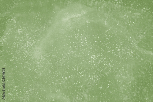 Green spring watercolor texture with abstract washes and brush strokes on the white paper background. Chaotic abstract organic design.