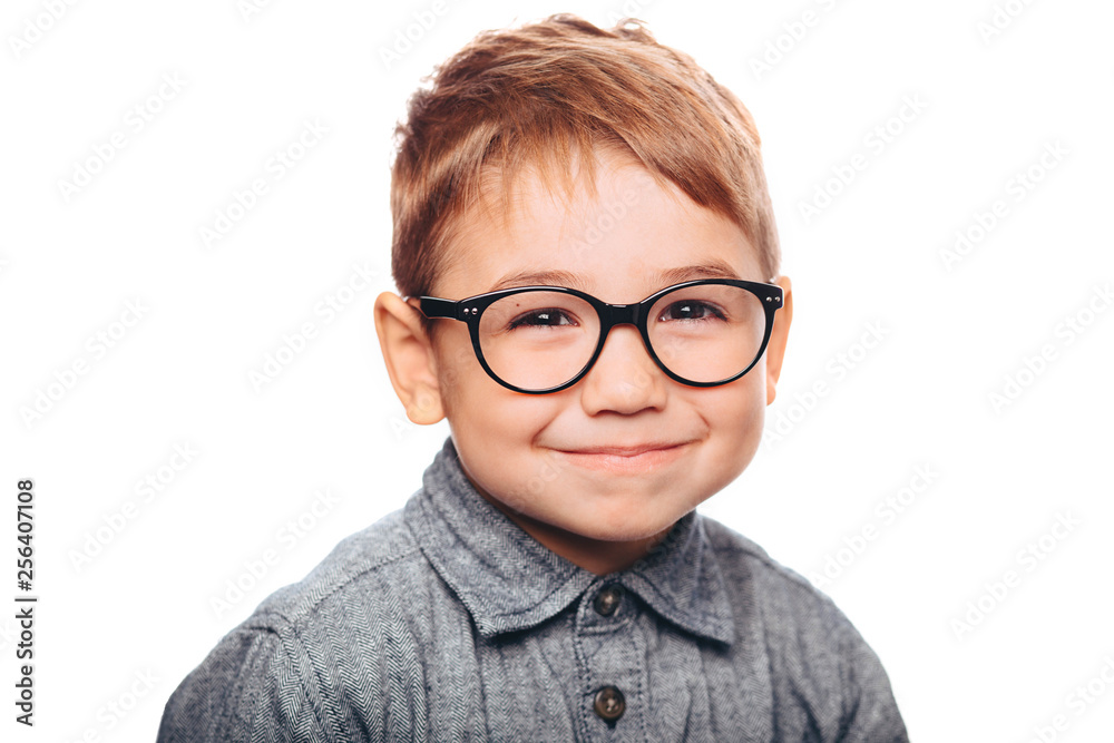 little boy with eyeglasses looking at camera on white background little boy with eyeglasses looking at camera on white background