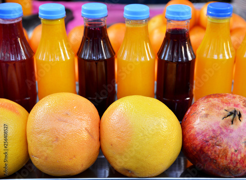 colorful glass bottles of  juice