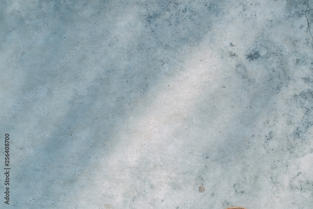 Obraz premium The texture of old white concrete. Sunlight and shadows on the wall.