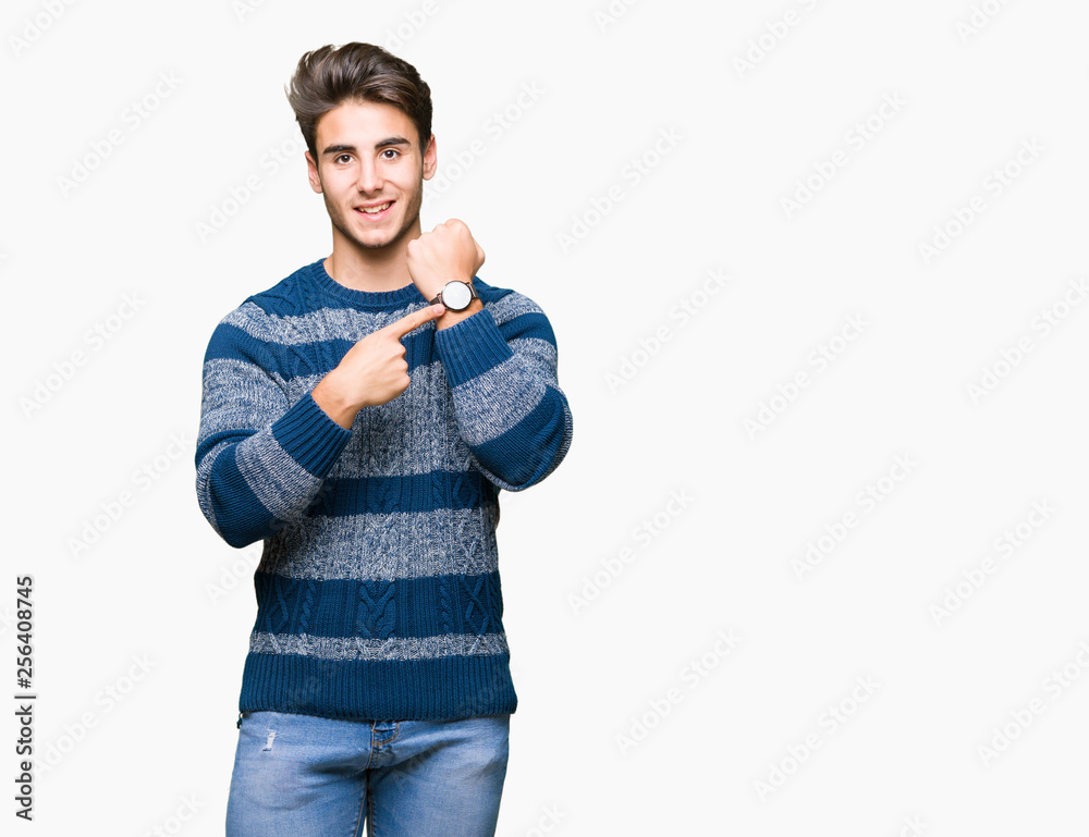 Young handsome man over isolated background In hurry pointing to watch time, impatience, upset and angry for deadline delay Young handsome man over isolated background In hurry pointing to watch time, impatience, upset and angry for deadline delay