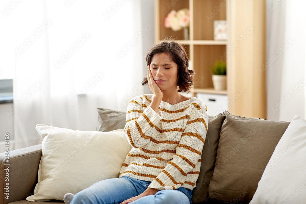 healthcare, dental health and problem concept - unhappy woman suffering from toothache at home healthcare, dental health and problem concept - unhappy woman suffering from toothache at home