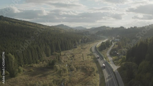 Wallpaper Mural Aerial drone view of trucks on motorway in mountains at sunset Torontodigital.ca
