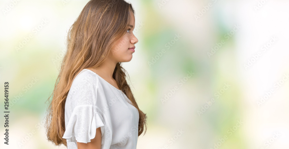 Young beautiful brunette business woman over isolated background looking to side, relax profile pose with natural face with confident smile. Young beautiful brunette business woman over isolated background looking to side, relax profile pose with natural face with confident smile.
