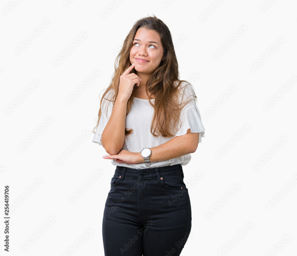 Young beautiful brunette business woman over isolated background with hand on chin thinking about question, pensive expression. Smiling with thoughtful face. Doubt concept. Young beautiful brunette business woman over isolated background with hand on chin thinking about question, pensive expression. Smiling with thoughtful face. Doubt concept.