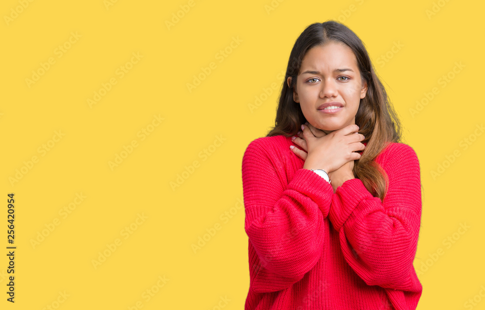 Young beautiful brunette woman wearing red winter sweater over isolated background shouting and suffocate because painful strangle. Health problem. Asphyxiate and suicide concept. Young beautiful brunette woman wearing red winter sweater over isolated background shouting and suffocate because painful strangle. Health problem. Asphyxiate and suicide concept.