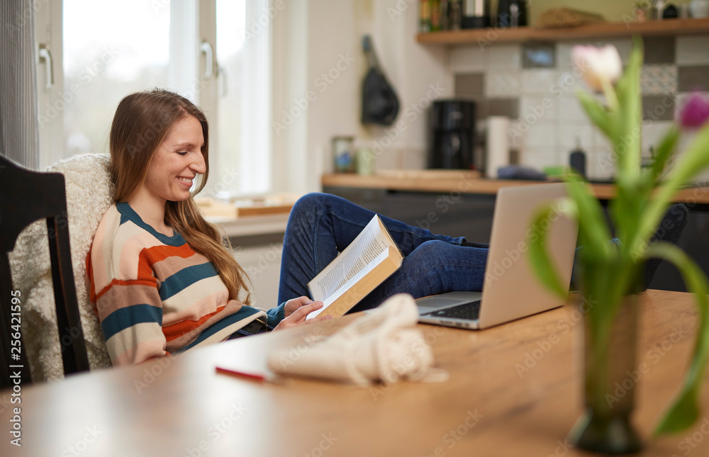 Beautiful blonde woman reading a book smiling Beautiful blonde woman reading a book smiling