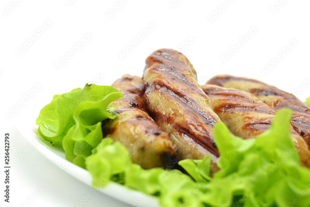 fried sausages and salad on a white plate fried sausages and salad on a white plate
