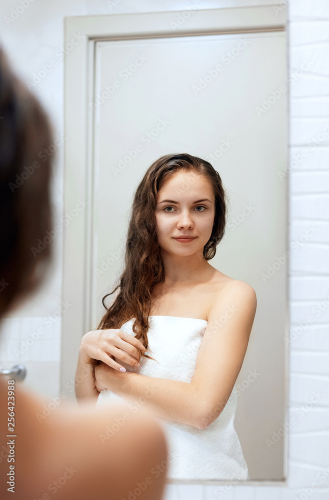 Wet hair woman portrait, beauty hair healthy skin care concept, beautiful model with wet hair in bathroom.