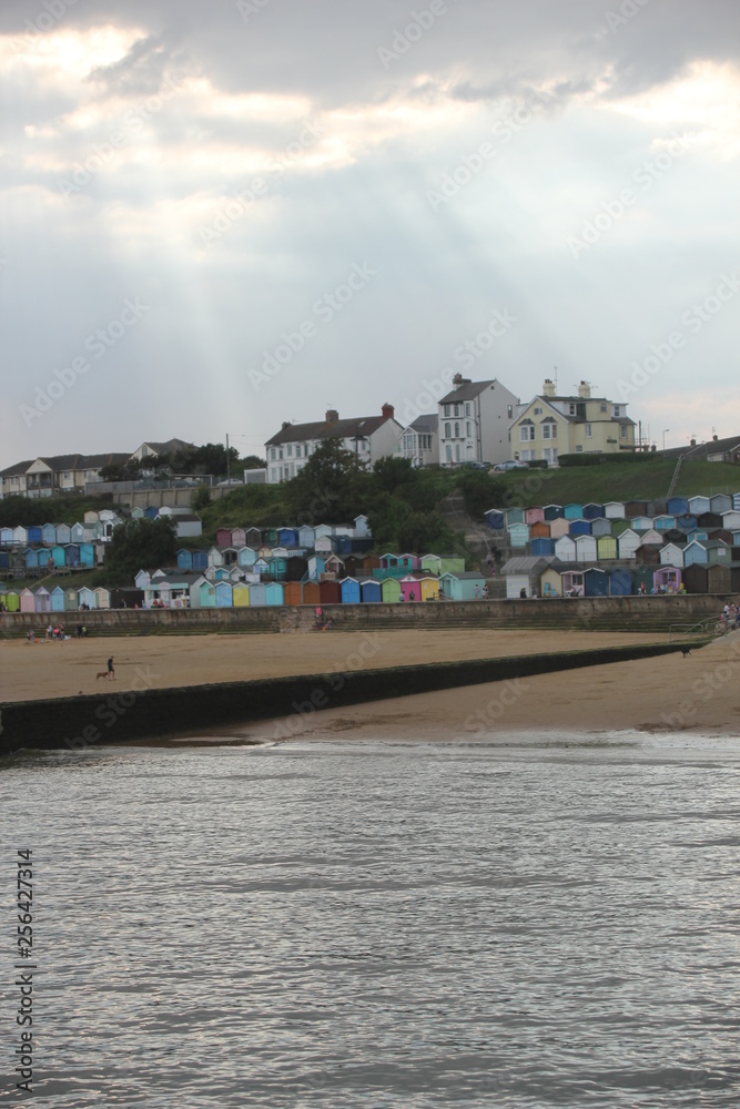 Naklejka premium Beach huts at Walton on the Naze, Beach Huts, Essex, England, beach huts are traditional seaside feature for people to change or base themselves. Walton-on-naze, Essex, UK