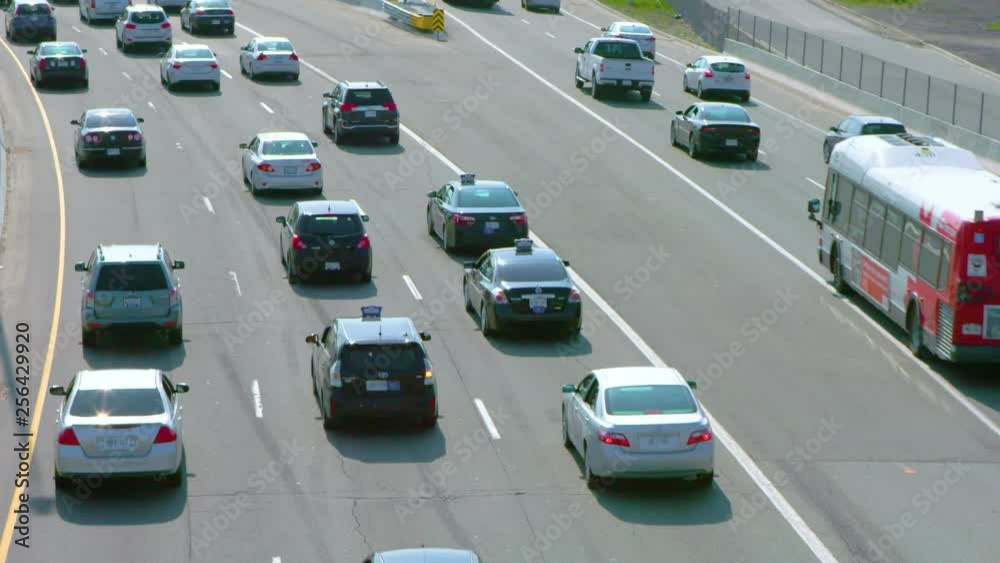 Medium rear shot of traffic on highway Medium rear shot of traffic on highway