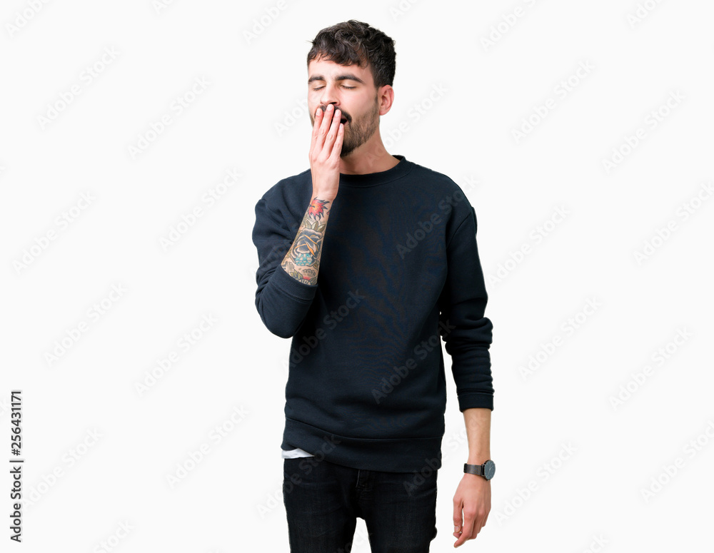 Young handsome man over isolated background bored yawning tired covering mouth with hand. Restless and sleepiness. Young handsome man over isolated background bored yawning tired covering mouth with hand. Restless and sleepiness.