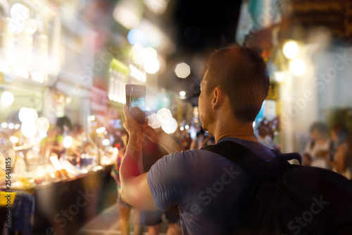 Phuket old town talang road on sunday evening walking street ..Man enjoying shopping and sightseeing in atmosphere of sino portuguese architecture shopfront and crowd of tourist .. photo