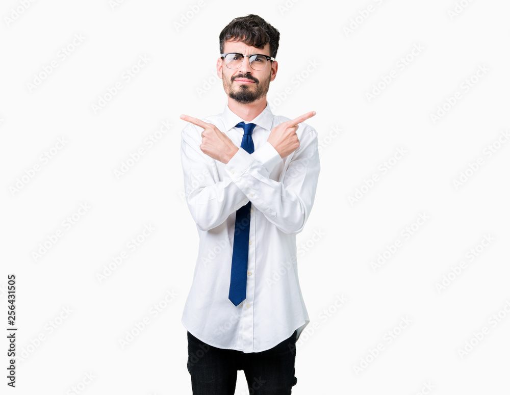 Young handsome business man wearing glasses over isolated background Pointing to both sides with fingers, different direction disagree Young handsome business man wearing glasses over isolated background Pointing to both sides with fingers, different direction disagree