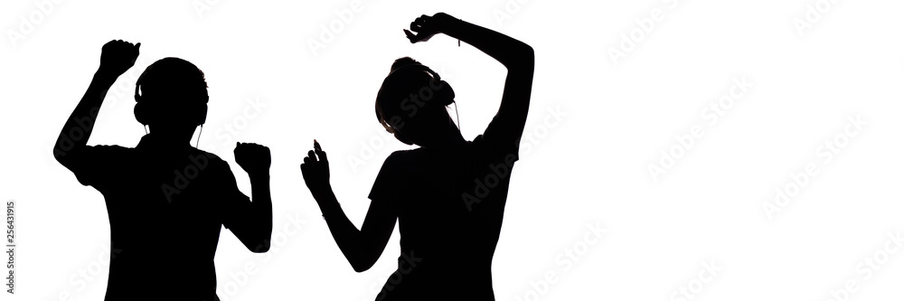 silhouette of figures of teenagers in headphones listening to music, the guy and the girl are dancing with hands up, the concept of a party and youth lifestyle on a white isolated background