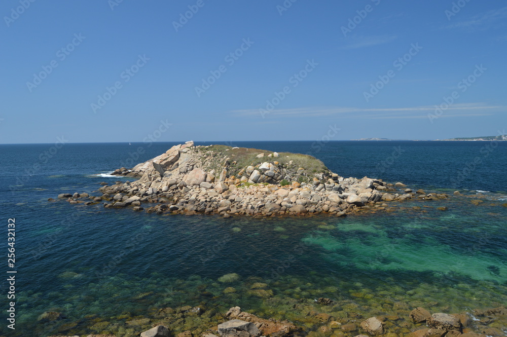 Islet Of The Illariña Turquoise Waters Surrounding Seen From The Fort Of The Hermitage In La Lanzada In Noalla. Nature, Architecture, History, Travel. August 19, 2014. Noalla, Pontevedra, Spain.