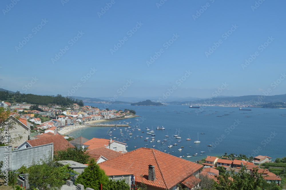 Beautiful views of the town of Raxo and the beach of Xiorto. Nature, Architecture, History. August 19, 2014. Raxo, Pontevedra, Galicia, Spain.