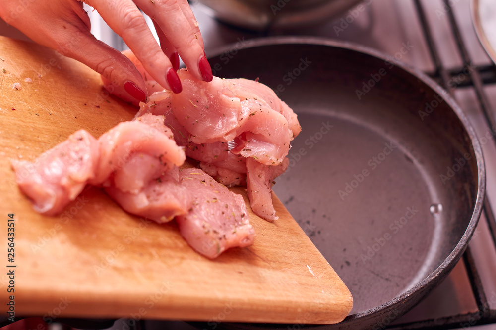 Raw chicken in the pan