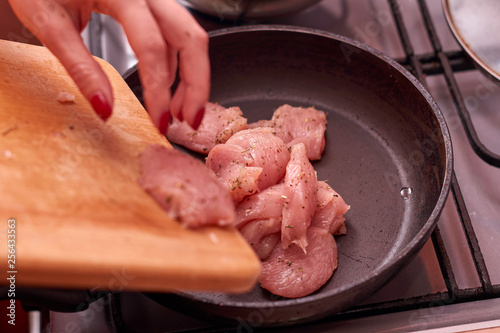 Raw chicken in the pan