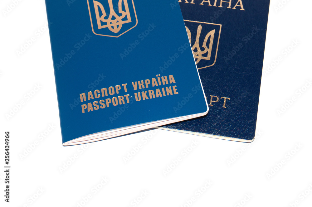 Two passports, foreign and Ukrainian on a white background, copy space for text Two passports, foreign and Ukrainian on a white background, copy space for text