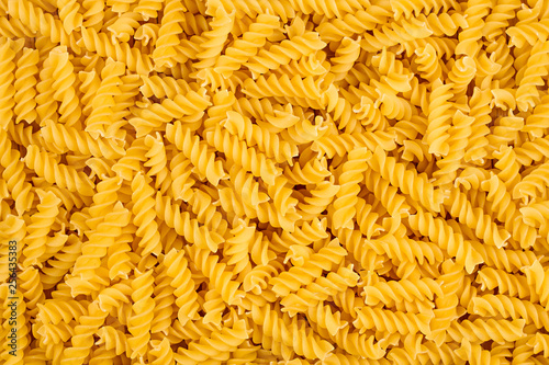 texture of raw spirelli noodles pasta italian food macro background